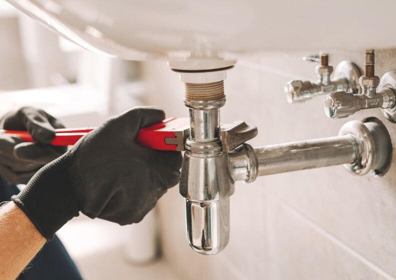clogged drain being cleared by professional plumber